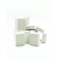 A pile of mini white buffer blocks on a white table